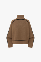 Brown turtleneck sweater with black trim on a white background