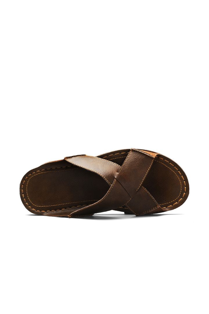 Men’s brown cross-strap leather slide sandals with cowhide upper and stitched footbed design upper view