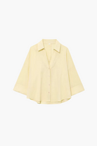 Light yellow shirt on a white background