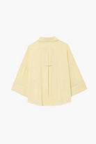 Light yellow shirt on a white background