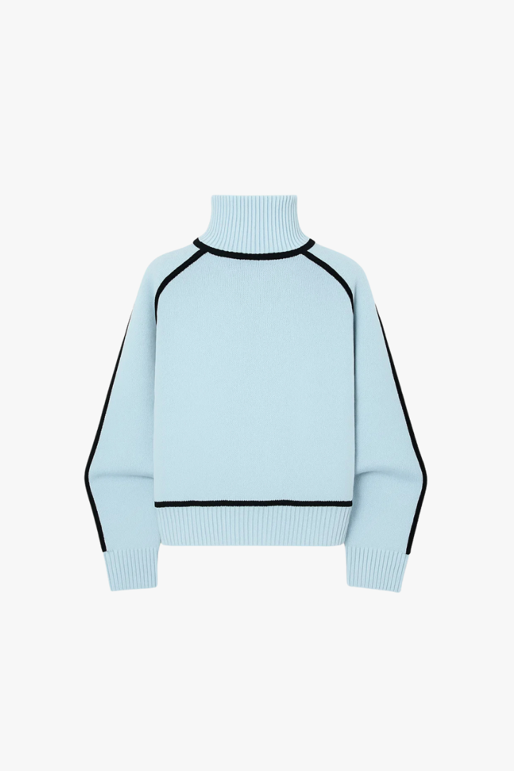 Light blue sweater with black accents on a white background
