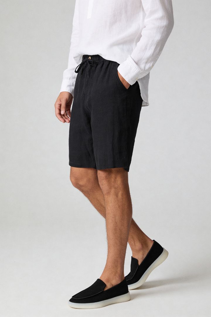Men’s 100% linen black drawstring shorts with elastic waist and relaxed summer fit side view