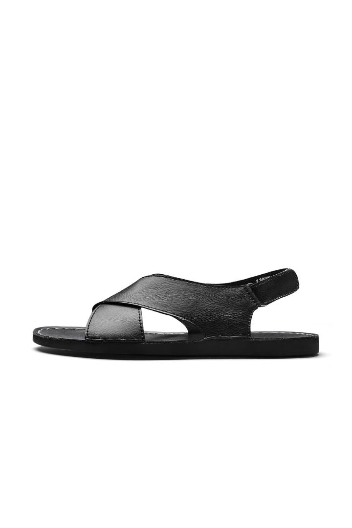 Men’s black leather cross-strap sandals with adjustable heel strap and stitched sole detail side view