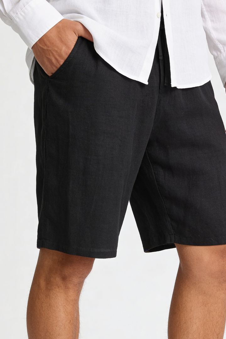 Men’s 100% linen black drawstring shorts with elastic waist and relaxed summer fit close-up