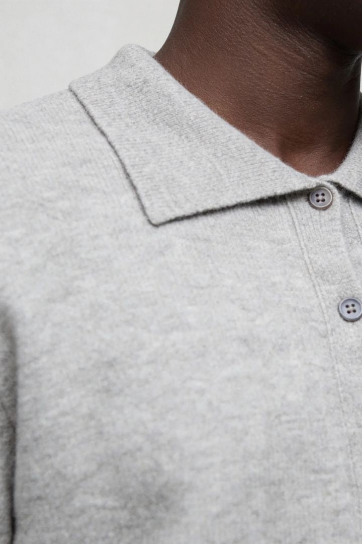 Men’s 100% wool gray knit cardigan sweater with button front and classic collar design close-up