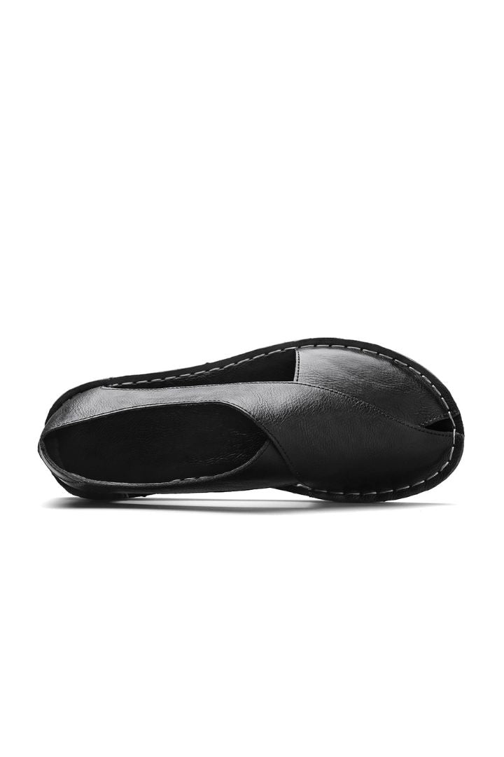 Men’s black breathable leather open-side sandals with minimalist summer slip-on design and flexible sole upper view