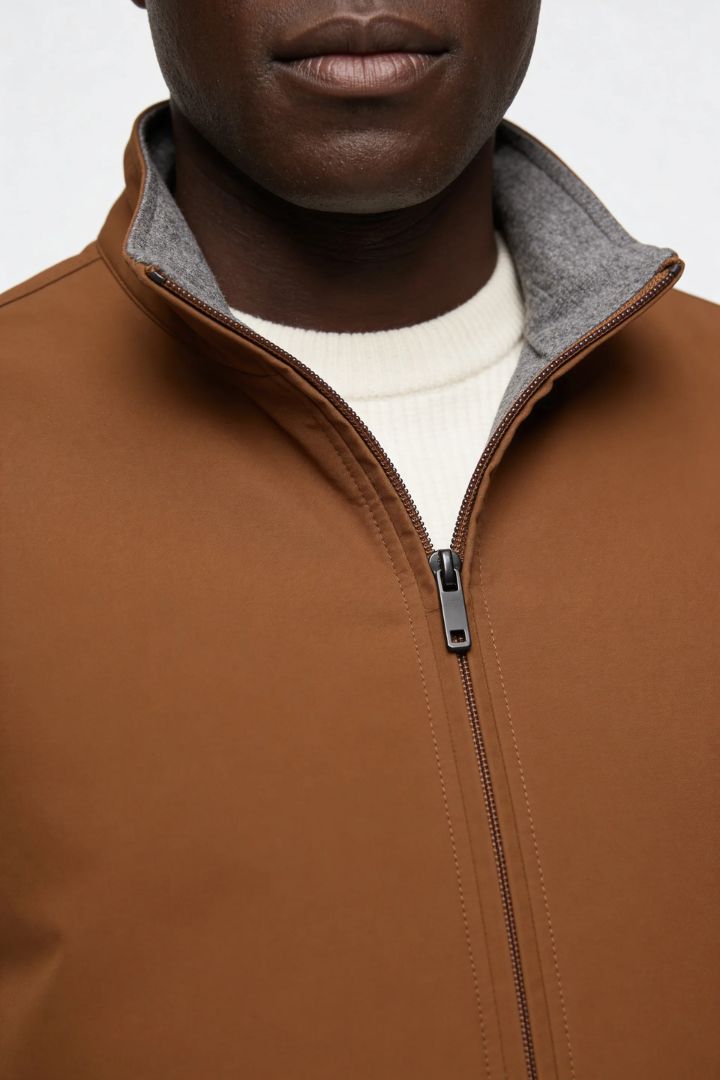 Men’s slim fit reversible lightweight zip vest for smart casual layering brown close up