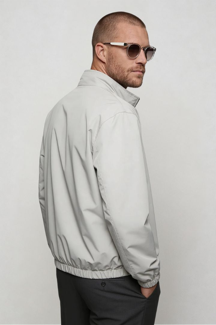 Men’s lightweight reversible zip up jacket with slim fit modern casual design side pose