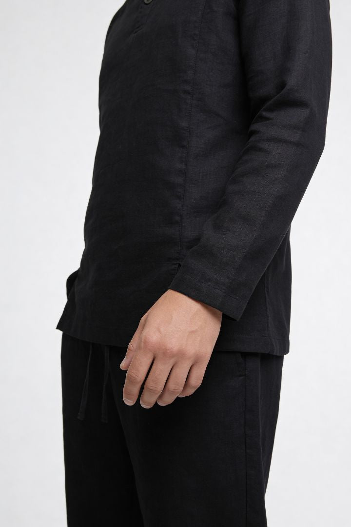 Men’s black linen polo shirt and linen pants summer outfit set with relaxed tailored fit close-up