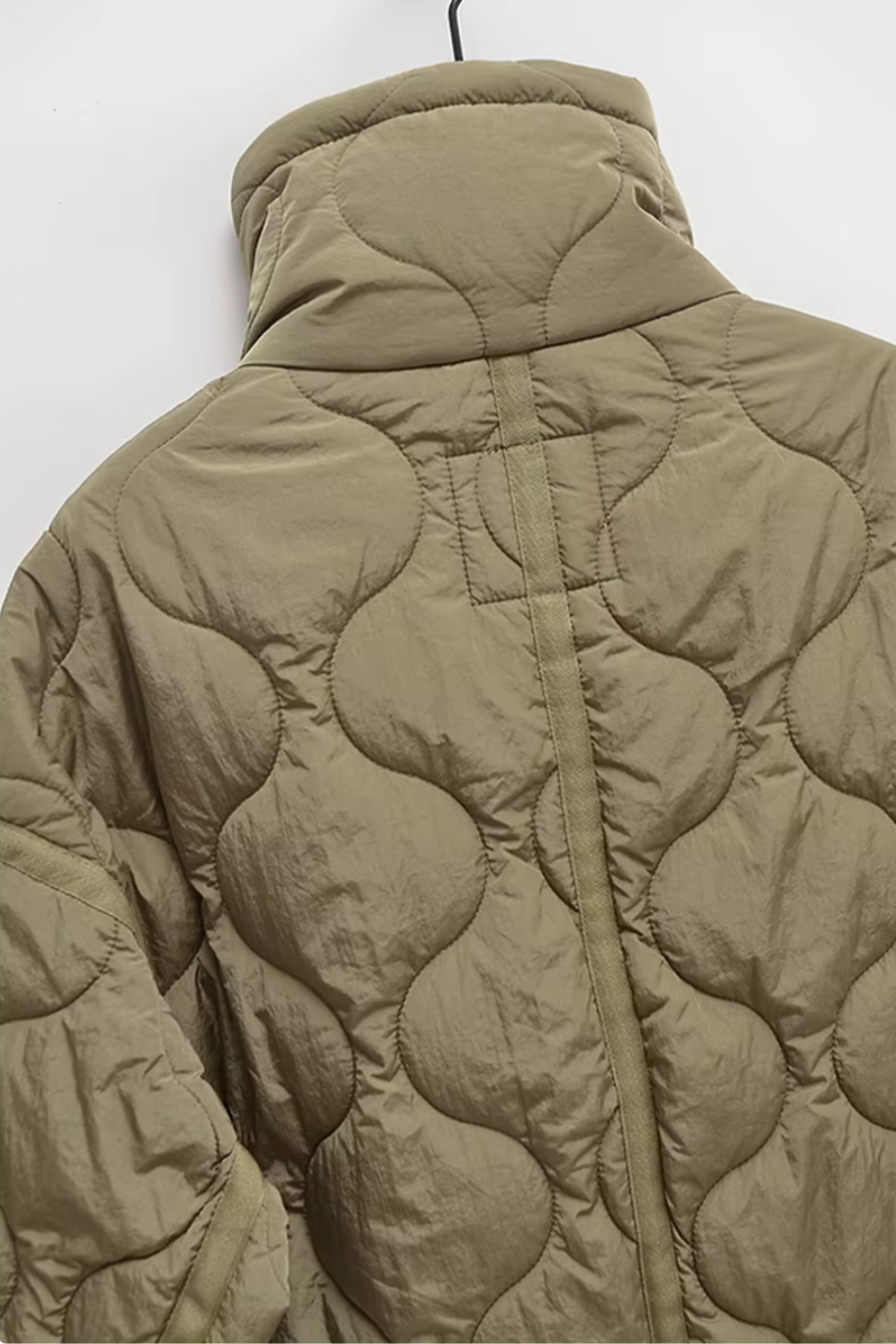 High stand collar and sleeve cuff on women’s olive quilted jacket