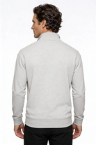 Man wearing a light gray jacket on a white background