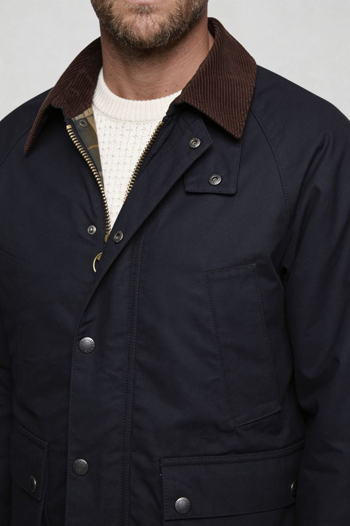 Men’s cotton field jacket with corduroy collar and utility pocket design navy front close-up