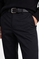 Famous guy posing with a black tailored stretch trouser of Lavencio