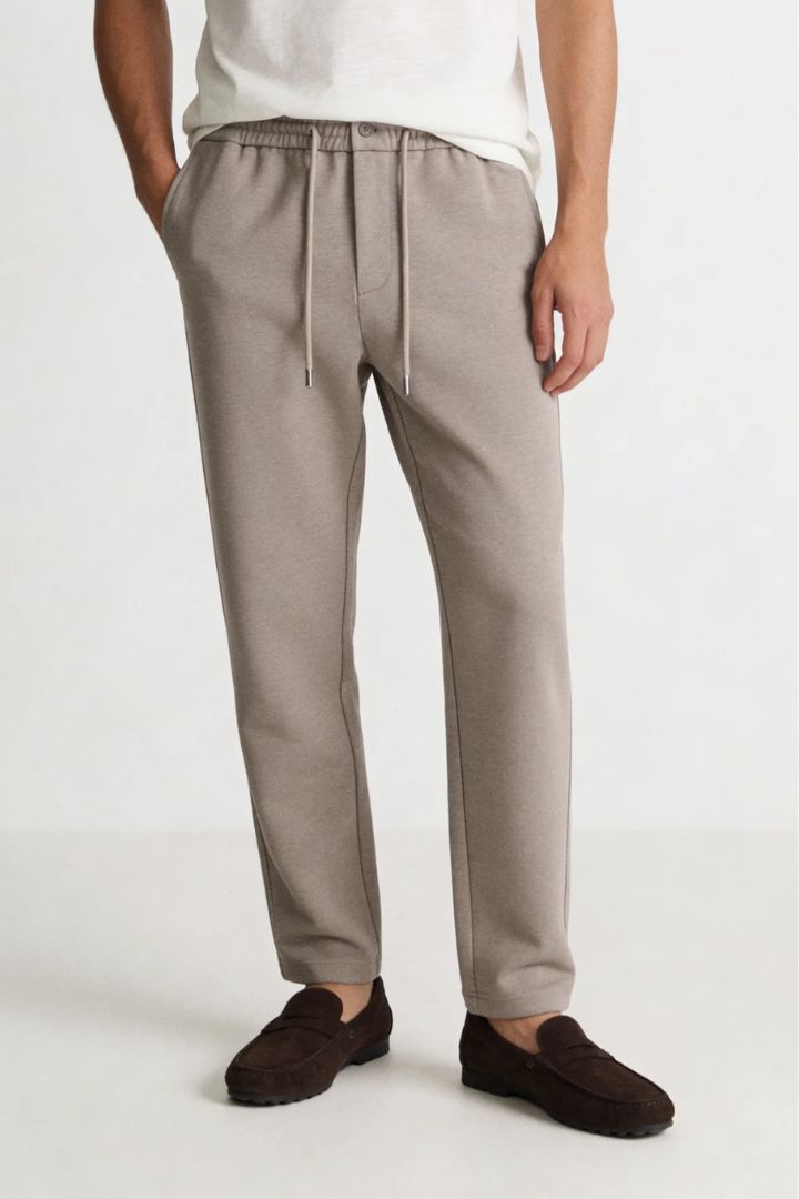 Men’s wool blend drawstring trousers in sand taupe – front view