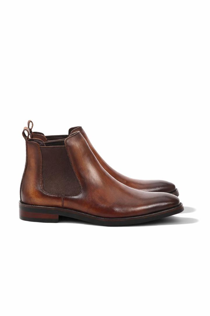 Premium men’s leather Chelsea boots in brown with elastic side panels and sleek slip-on ankle boot design side view