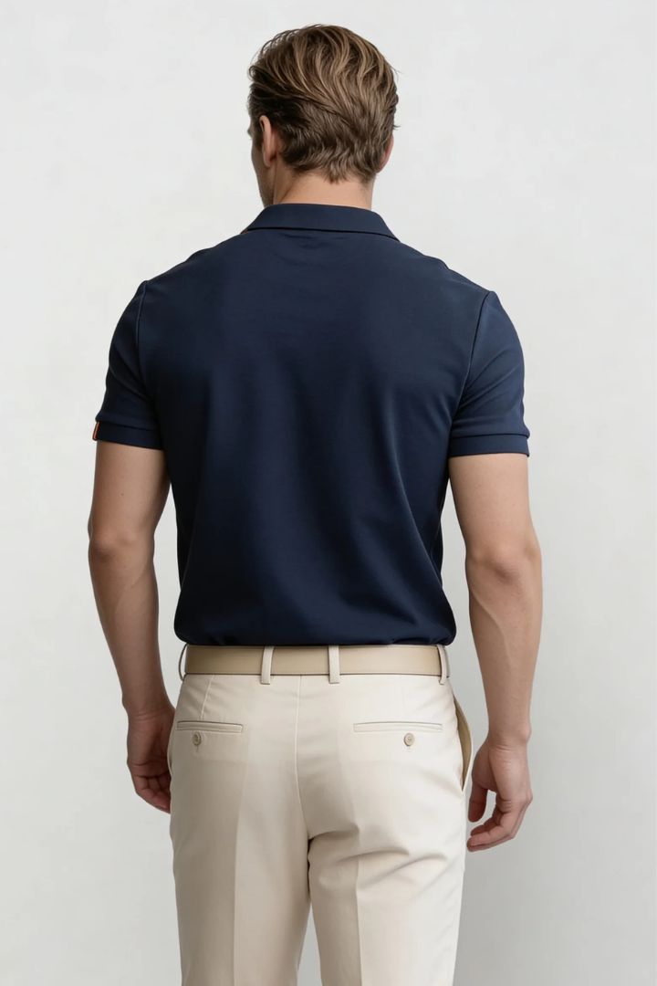 Men’s navy cotton polo shirt with tailored fit and structured collar back pose