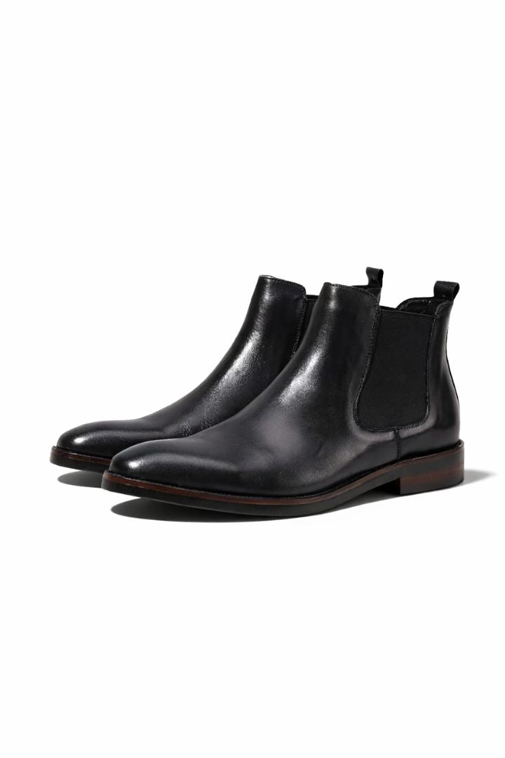 Premium men’s leather Chelsea boots in black with elastic side panels and sleek slip-on ankle boot design