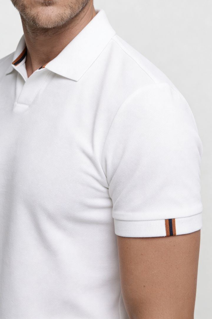 Men’s white cotton polo shirt with tailored fit and structured collar close up