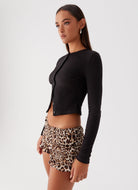 Side view—black ribbed cropped button top for women