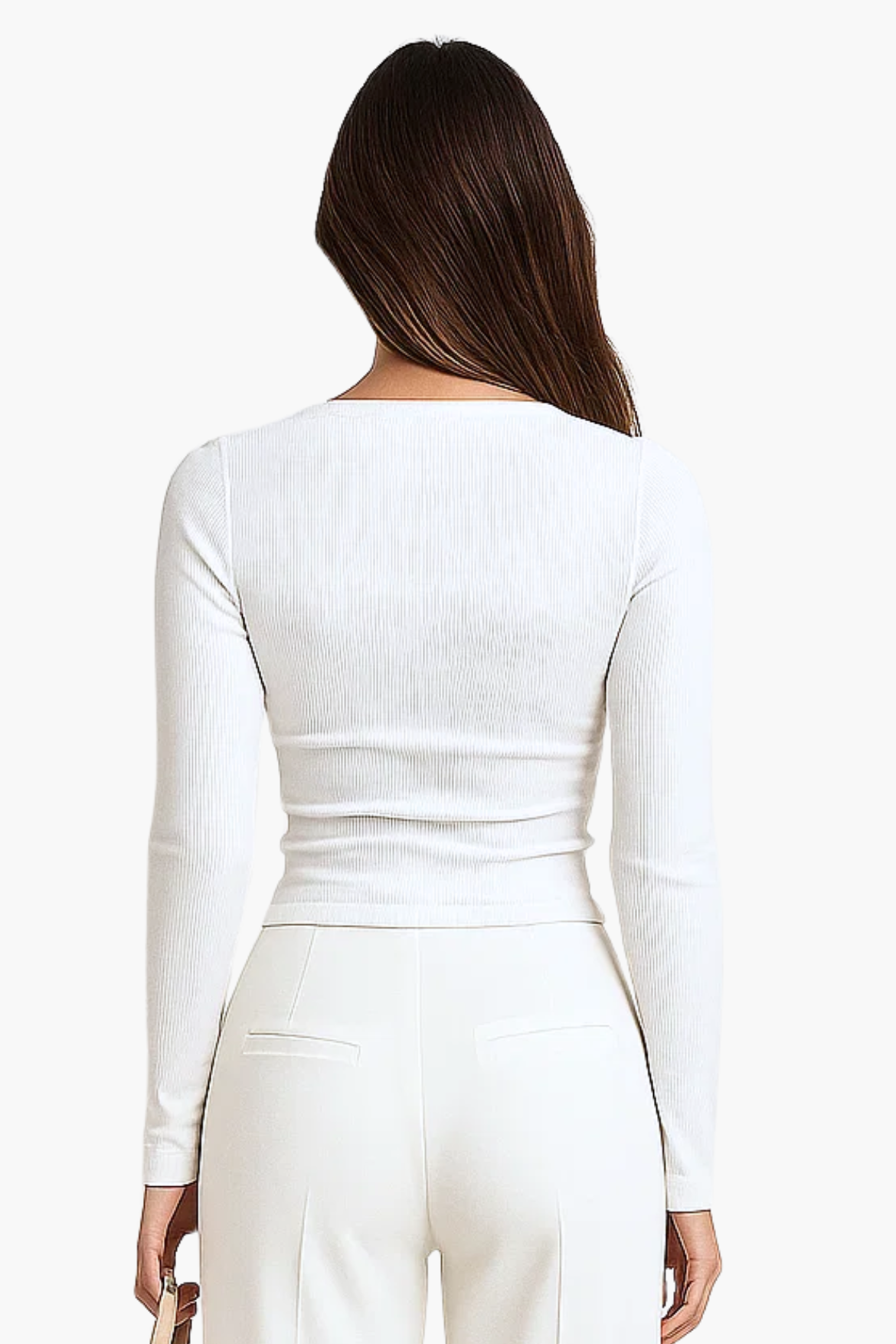 Person wearing a white long-sleeve top and pants on a white background