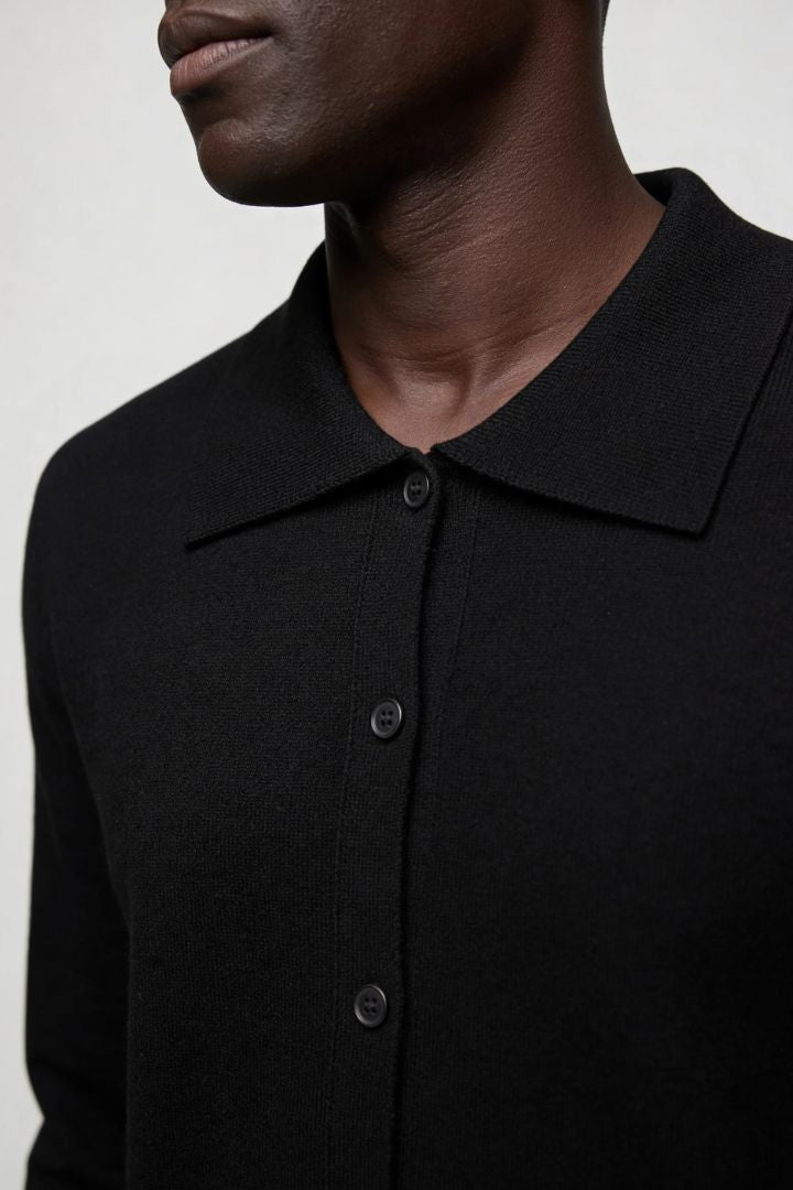 Men’s 100% wool knit cardigan sweater in black with button front and classic collar design close-up